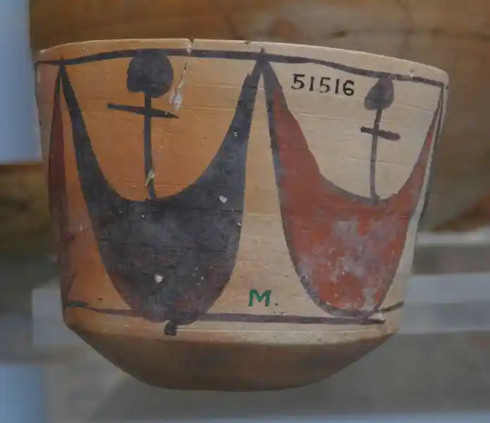 Fine ware cup with debased ankh and crescent motif Fine ware cup with debased ankh and crescent motif